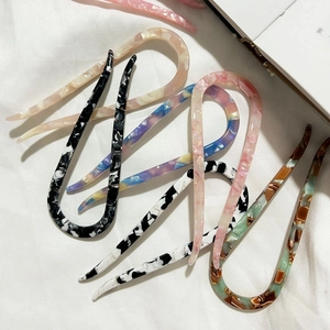 Chic U-shaped acetate hair pins in multiple patterns like marble and tortoiseshell for women