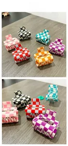 Detailed tile display of various colorful checkered hair claws on a wooden background