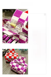 Detail view of colorful checkered hair clips with durable golden metal springs