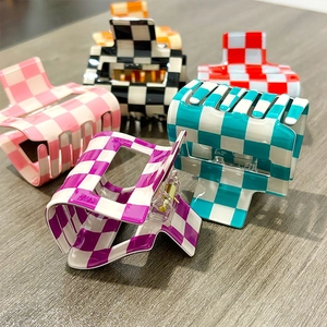 Colorful checkerboard pattern PVC hair claws with metal springs in various retro colors