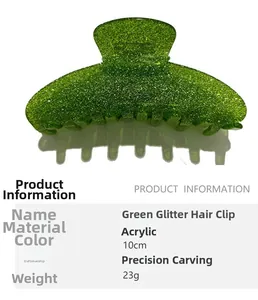Macro detail of a 10cm green glitter acrylic shark hair claw clip with carved craft