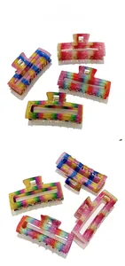 Macro detail of large rainbow glitter hair claw clip with rectangle hollow design