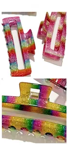Detail view of large rainbow glitter hair claw clip with strong metal spring and rectangle design