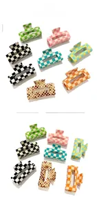 Detail view of colorful checkerboard hair clips in green pink black and blue tones