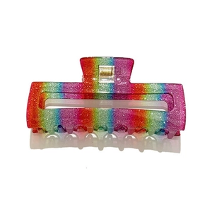Close-up of rainbow sequin hair claw clip with golden spring and sparkling gradient finish