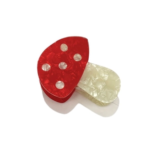 Pince à cheveux mignonne en forme de champignon rouge avec texture marbrée élégante