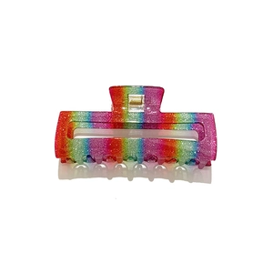 Rainbow gradient glitter hair claw clip with rectangular cutout and shimmering finish