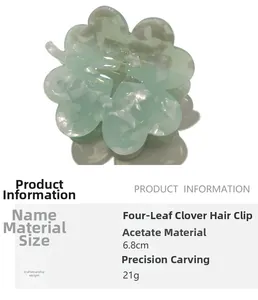 Macro detail of mint green acetate hair claw with clover shape and 6.8cm size