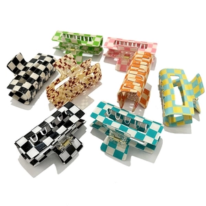 Checkerboard pattern hair claw clips in multiple vibrant colors on white background