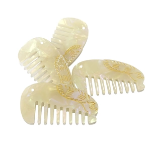 Set di 4 pettini in acetato bianco perlato con decorazione a coniglio dorato