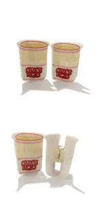 Detail view of a creative instant ramen cup hair claw clip with transparent plastic base