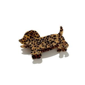 Dachshund hair claw clip with leopard print pattern and gold accents on white background