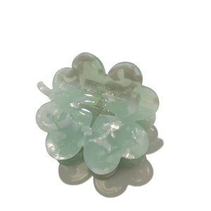Elegant mint green flower hair claw clip with acetate marble texture for women