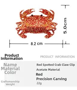 Detail view of red spotted crab hair claw clip with dimensions 8.2cm by 5.0cm