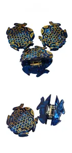 Detailed view of blue acetate fish-shaped hair claw clip with golden scale patterns