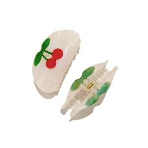 Semicircle cherry hair claw clip in white acetate with pearl luster and gold spring