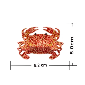 French crab hair claw clip made of cream acetate with orange spots and gold lines