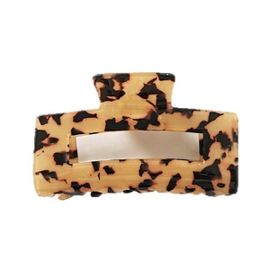 French hollow rectangular hair claw with classic tortoiseshell pattern on white background