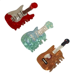 Creative guitar-shaped acrylic hair claws in red, green and wood grain patterns