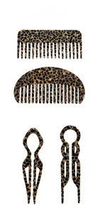 Detail of tortoise shell acetate hair combs and U-shaped hair pins set for bun styling