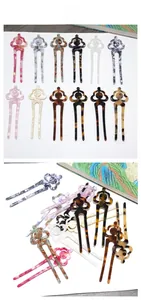 Close-up of U-shaped acetate hair pins featuring 12 different marbled and floral patterns