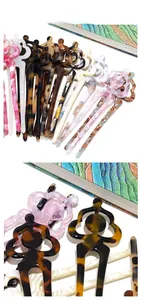 Detailed tile display of acetate U-shaped hairpins with colorful marble and floral patterns