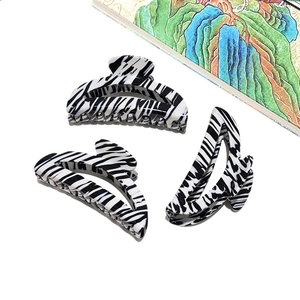 Large French acetate hair claw clip with black and white zebra pattern for elegant women