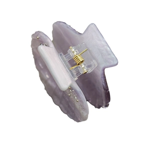 Elegant shell-shaped lavender hair claw clip with glitter finish and gold spring