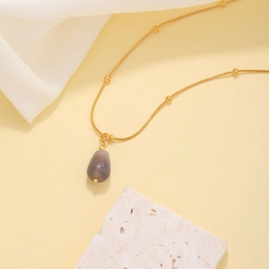 Elegant gold snake chain necklace with grey teardrop natural stone pendant and gold beads