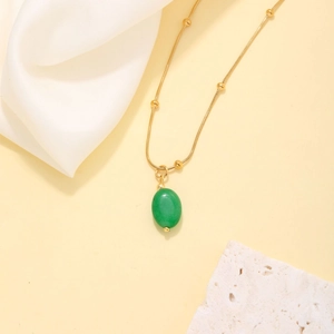 Elegant gold snake chain necklace with a translucent green drop gemstone pendant