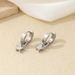 Detail of silver star earrings with round cubic zirconia in a prong setting