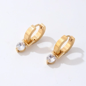Detail view of gold-plated hoop earrings featuring clear cubic zirconia crystal drops