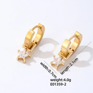 Detail showing gold-plated star drop earrings with dimensions 0.7cm by 2.1cm