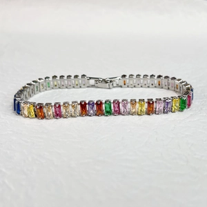 Detailed top view of rainbow cubic zirconia tennis bracelet with silver metal base