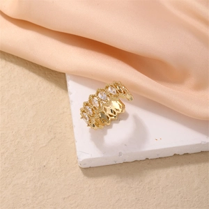 Macro shot of gold plated adjustable ring with marquise cut zircon stones and lace detail