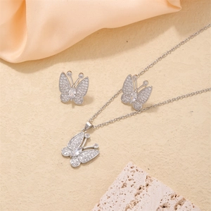 Elegant butterfly pendant necklace and earrings set with sparkling cubic zirconia pavé