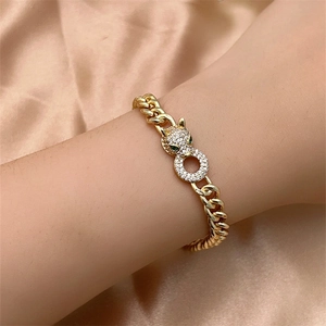 Luxury gold cuban link bracelet for women featuring a leopard head with sparkling zircons