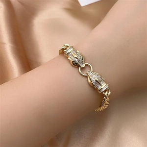 Detailed macro view of gold plated leopard head bracelet with sparkling crystal pavé
