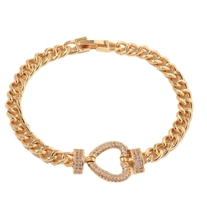 Luxury gold Cuban link bracelet with a heart pendant encrusted with pink cubic zirconia