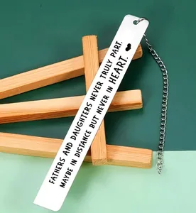 Detail of engraved stainless steel bookmark with heart charm for father gift