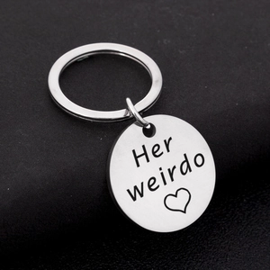 Polished stainless steel keychain engraved with Her Weirdo text and a small heart icon