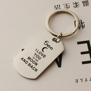 Detailed view of silver stainless steel keychain engraved with I love you to the moon