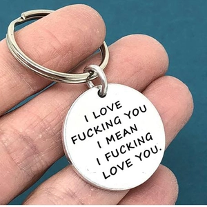 Polished stainless steel round keychain with engraved romantic message for couples