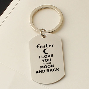 Close-up of Sister I Love You to the Moon and Back engraved stainless steel keychain