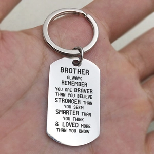 Polished stainless steel dog tag keychain with motivational engraving for brother or sister