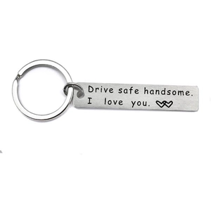 Detail view of brushed stainless steel keychain with Drive safe handsome engraving