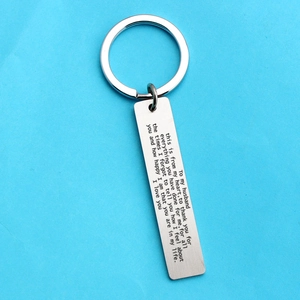 Brushed stainless steel keychain with engraved romantic message for husband on blue background