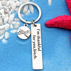 Stainless steel keychain with pink starfish beach background and engraved friendship text