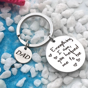 Detailed macro view of Father's Day stainless steel keychain with Dad heart charms