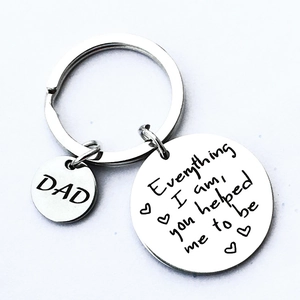 Close-up of stainless steel keychain with Dad heart engraving and sentimental quote